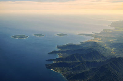 Aerial view of sea against sky during sunset