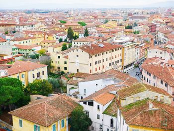 High angle view of houses in town against sky