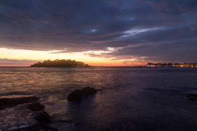 Scenic view of sea against dramatic sky