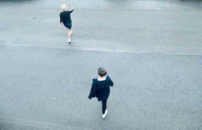 Full length of woman walking on road