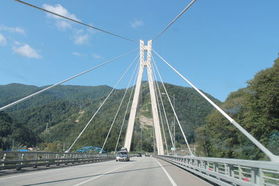 Suspension bridge against sky