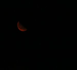 Low angle view of moon against sky at night