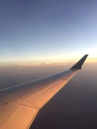 Aerial view of airplane wing against clear sky