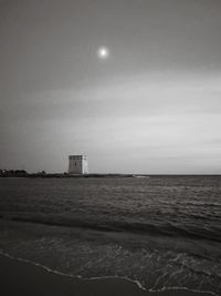 Scenic view of sea against sky at night