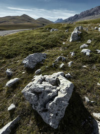 Rocks on land against sky