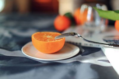 Close-up of orange juice on table