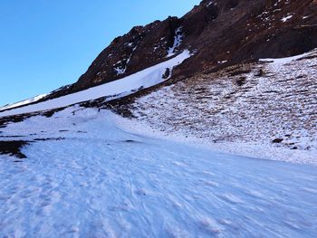 Snow covered mountain against sky