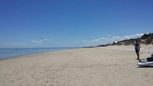 Scenic view of beach against blue sky