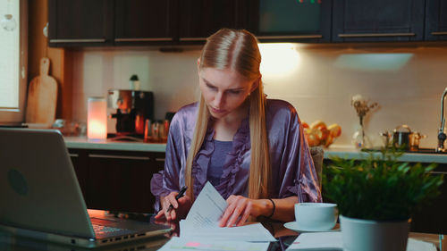 Young woman working at home