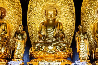 Buddha statue in temple outside building