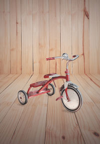 Bicycle on hardwood floor at home