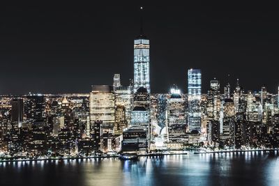 High angle view of illuminated cityscape against sky at night