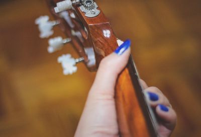 Close-up of hand holding finger