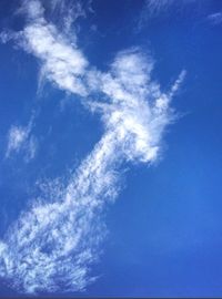 Low angle view of vapor trail in blue sky