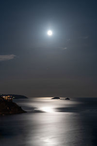 Scenic view of sea against sky at night