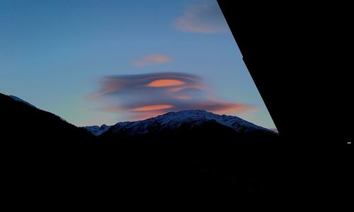 Silhouette mountains against sky during sunset