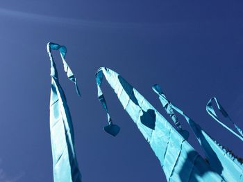 Low angle view of tree against blue sky