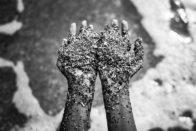 Close-up of woman holding sand