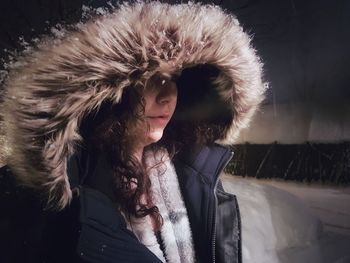 Portrait of woman with ice cream in winter