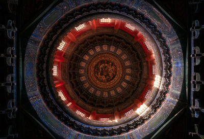 Directly below shot of illuminated ceiling in building