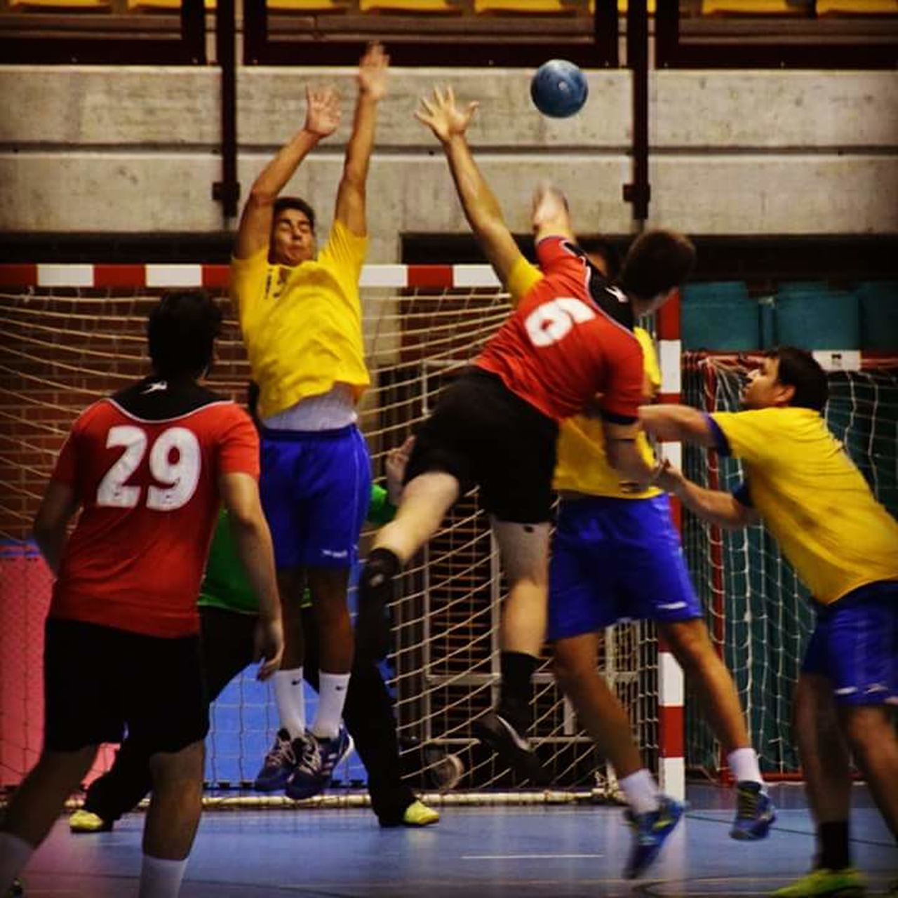 sport, competition, arms raised, basketball - sport, challenge, men, indoors, leisure activity, competitive sport, basketball player, real people, playing, sports uniform, sports team, sportsman, motion, sports clothing, teamwork, athlete, young adult, coordination, day, adult, only men, people, adults only