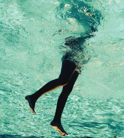 Low section of woman in swimming pool