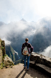 Rear view of senior man against mountains