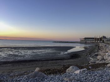 Scenic view of sea against sky during sunset