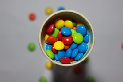 Close-up of multi colored candies in bowl