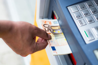 Close-up of hand holding mobile phone