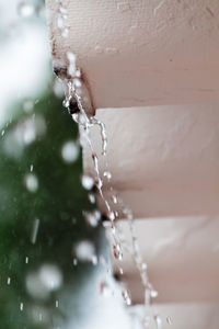 Close-up of water drop falling on ice