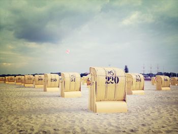 View of beach against cloudy sky