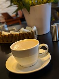 Close-up of coffee cup on table