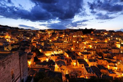 High angle shot of illuminated cityscape against sky