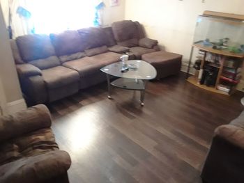 Sofa on hardwood floor at home