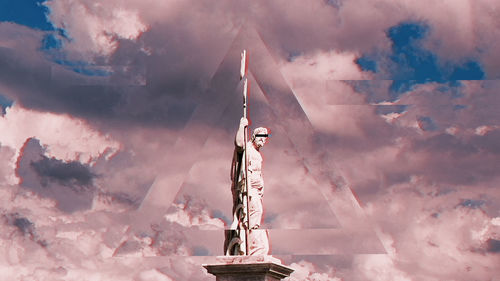Low angle view of statue against sky