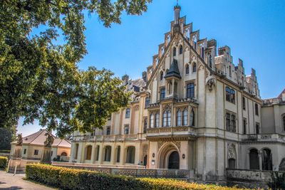 Low angle view of building against clear blue sky