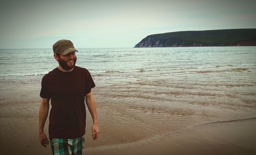 Woman standing on beach