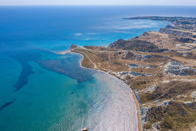 High angle view of sea shore against sky