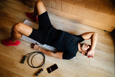 High angle view of man exercising at home