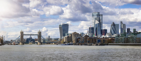 Panoramic view of sea and buildings against sky