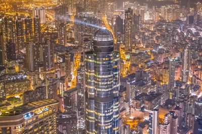 Aerial view of illuminated buildings in city at night