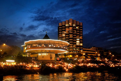 Illuminated building against sky at night