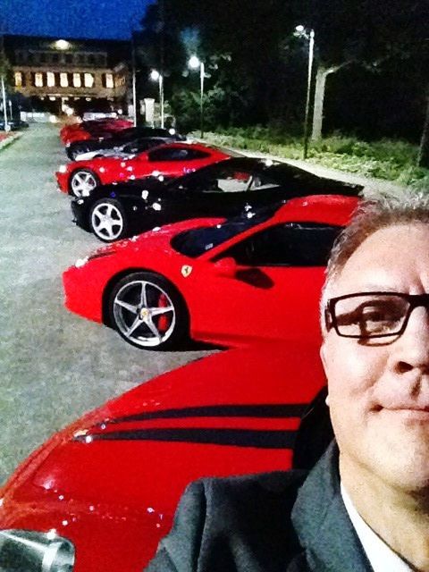 PORTRAIT OF MAN WEARING RED CAR