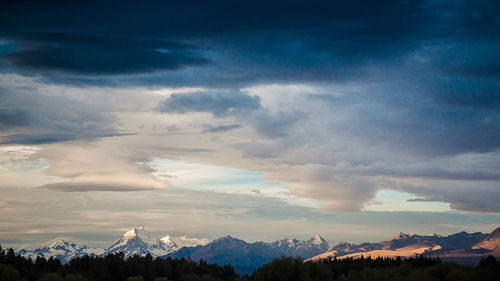 Scenic view of mountains against sky during winter