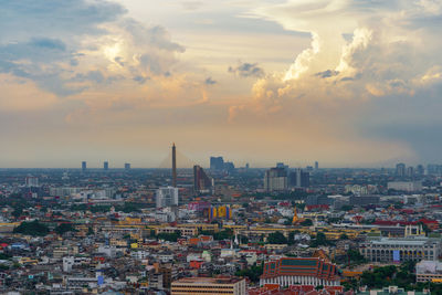 High angle view of city buildings during sunset