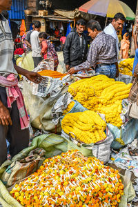 Group of people at market stall