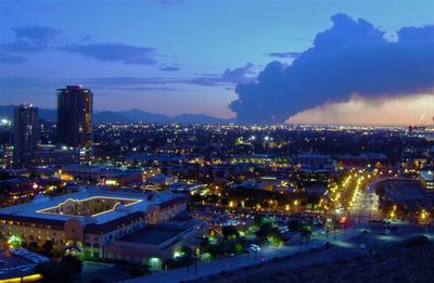 High angle view of illuminated buildings in city at night