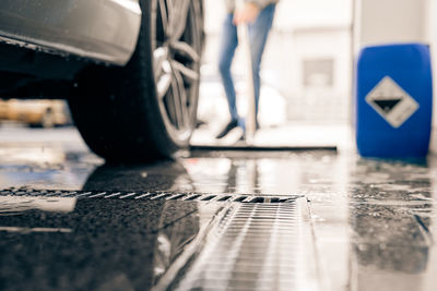 Low section of person on wet road