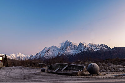 Scenic view of snowcapped mountains against clear sky